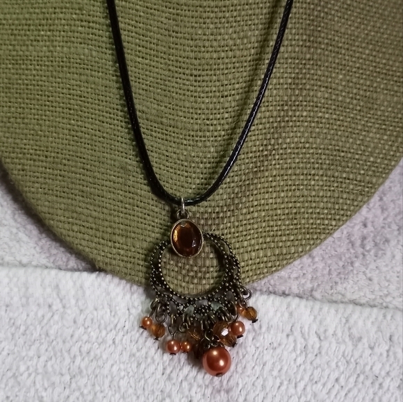 Goldtone decorative dangle amber color pendant on black cord - Picture 1 of 5